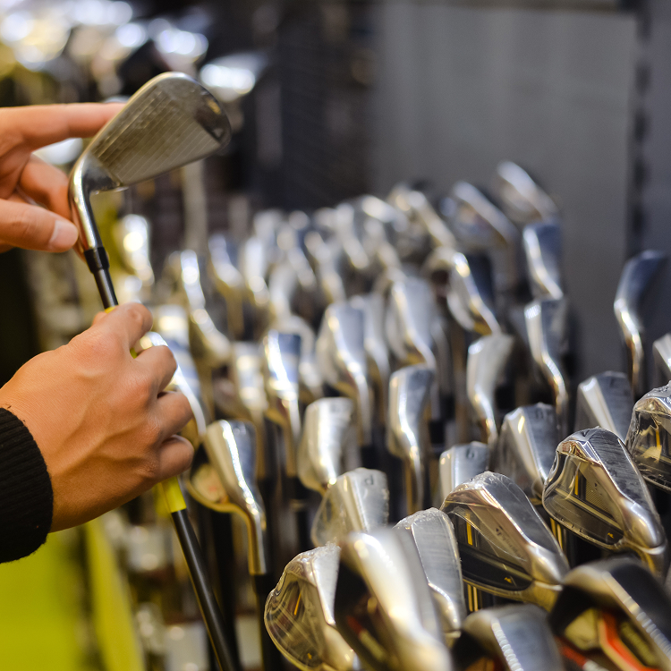 Man shopping in golf store
